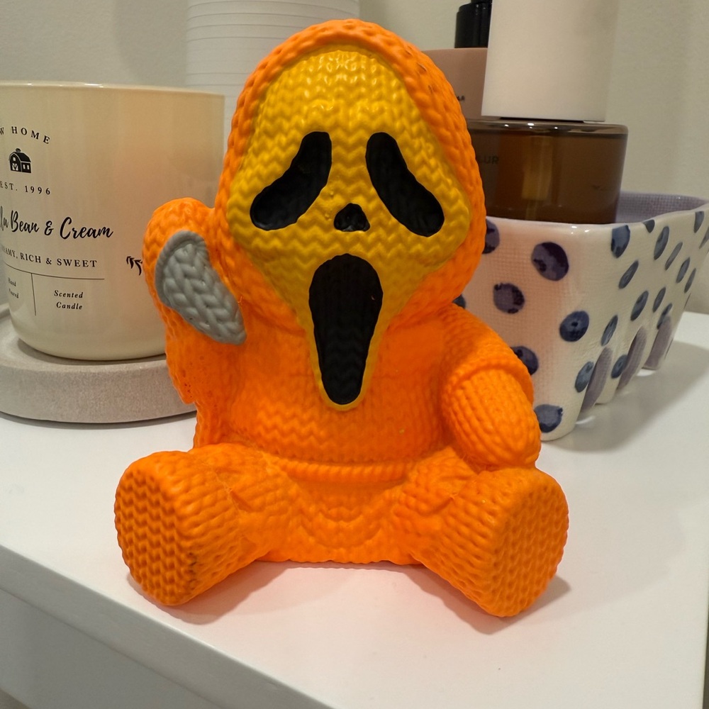 Orange Ghost Face Figurine